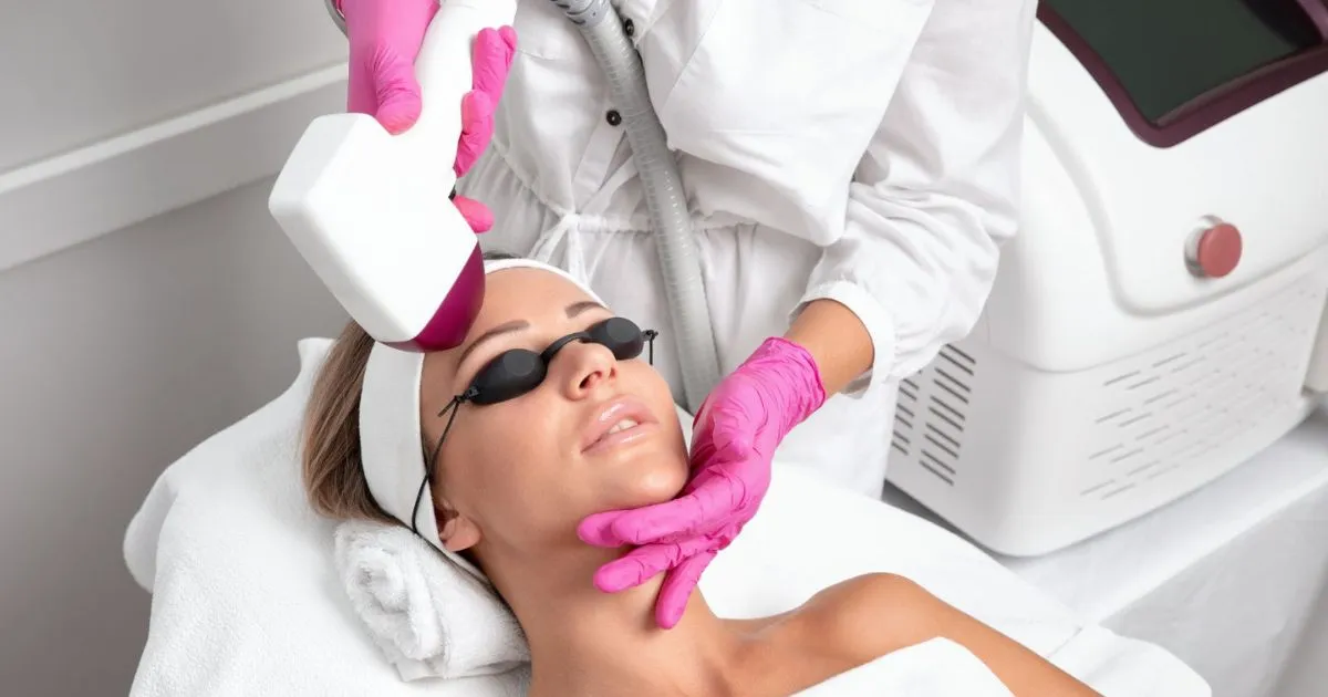 Aesthetician performing MOXI Laser skin rejuvenation on woman in Bend, OR